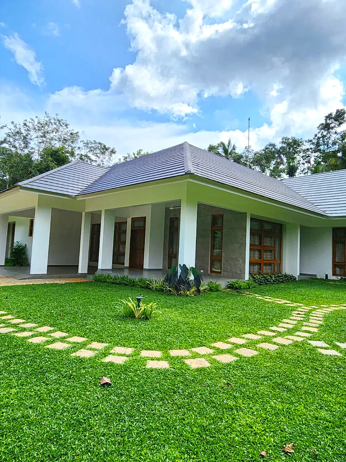 Garden landscaping and natural stone installation by Ozone Agro Landscapes